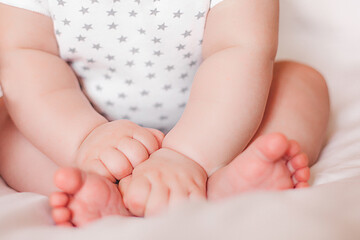 Tiny little baby feet. Adorable baby fingers. Cute infant closeup