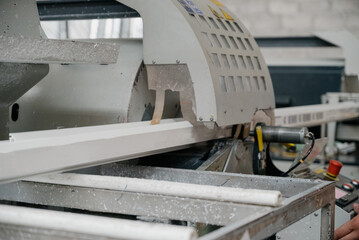 Factory for aluminum and PVC windows and doors production. Details industrial equipment.