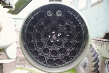 the back side of a soviet era rocket pod with its circular launcher tubes