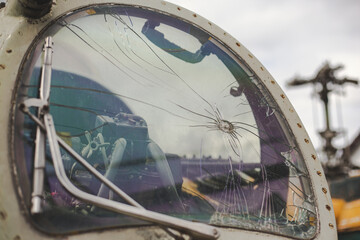 Bullet hole in the windshield of a Soviet era helicopter