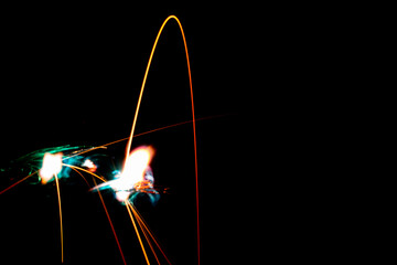 electric short circuit sparks spatter, glowing lines on black background