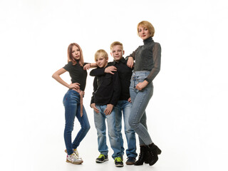 Fototapeta premium Mom and three children, two boys and a girl, in full growth, isolated on a white background