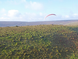 Paraglider soaring Pandy ridge in Wales