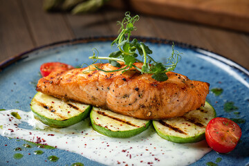 Grilled salmon steak with zucchini and creamy sauce