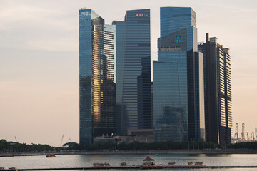 Singapore City,Singapore - May 01,2022: Low wide-angle view looking up to modern skyscrapers in business district of Singapore City.