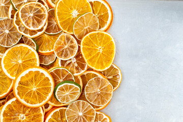 dried citrus fruits on a grey metallic background, space for text. High quality photo