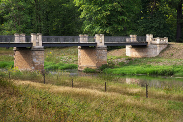 Englische bridge over Nysa Luzycka (Lausitzer Neisse) river at Park von Muskau (Park Muzakowski) near Bad Muskau. UNESCO World Heritage Site. Germany