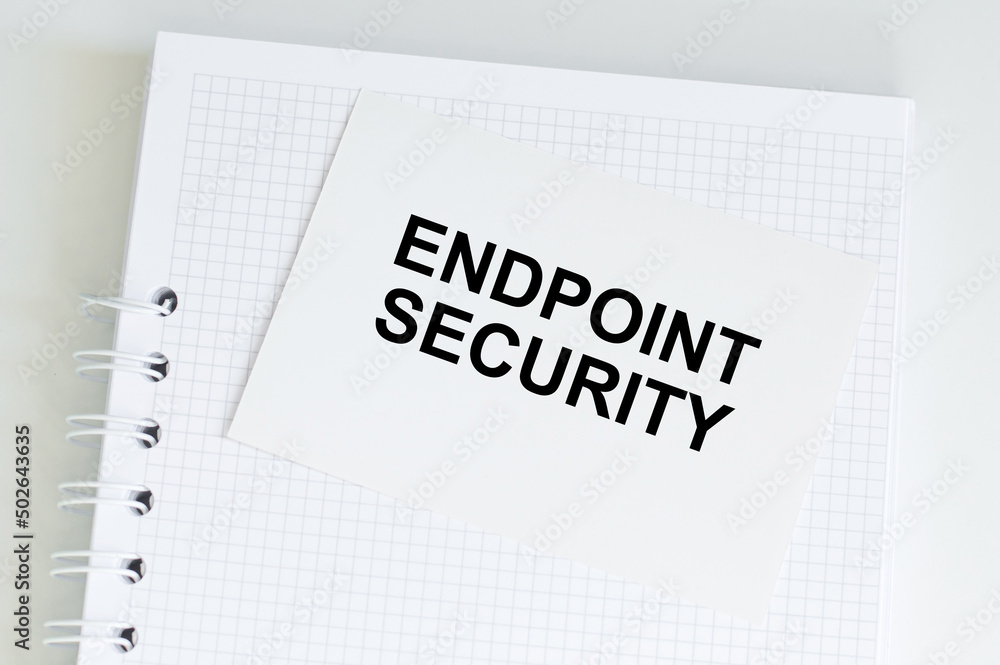 Poster business concept. text endpoint security on a white card on a white notepad on the table