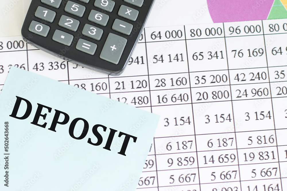 Poster deposit test on a blue card on the background of reports and charts on the table with a calculator