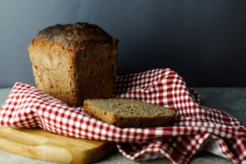 black malt rye bread on a checkered tablecloth