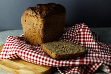 black malt rye bread on a checkered tablecloth