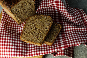 black malt rye bread on a checkered tablecloth