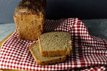 black malt rye bread on a checkered tablecloth