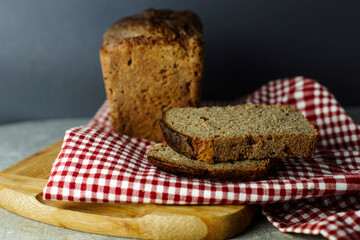 black malt rye bread on a checkered tablecloth