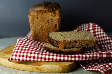 black malt rye bread on a checkered tablecloth
