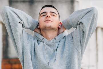 relaxed young male teenager breathing outdoors