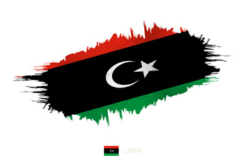 Painted brushstroke flag of Libya with waving effect.