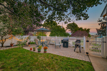 Cozy residential back yard at sunset - 502645661