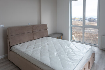 Interior of comfortable modern bedroom. Moving to a new apartment. Renting a new home. Summer vacation