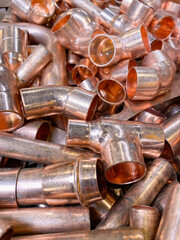 Copper tubes and elbows used by plumbers for water and gas installation