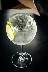 Cocktail with ice.  Mojito, aperol, soda, vodka, alcohol, martini.  Summer, cocktail, beach.  Cocktail on a black background.  Mint with lemon and ice.  Refreshing cocktail in hot weather