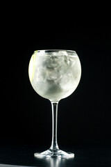 Cocktail with ice.  Mojito, aperol, soda, vodka, alcohol, martini.  Summer, cocktail, beach.  Cocktail on a black background.  Mint with lemon and ice.  Refreshing cocktail in hot weather