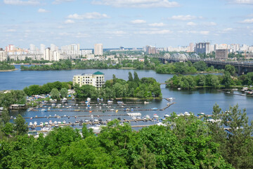 View of the city of Kiev and the Dnieper River. A cityscape on a summer, sunny day. High quality photo