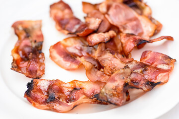 slices of bacon dripping grease straight from the heat