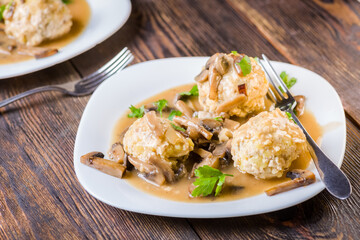 meat and potato balls in mushroom sauce
