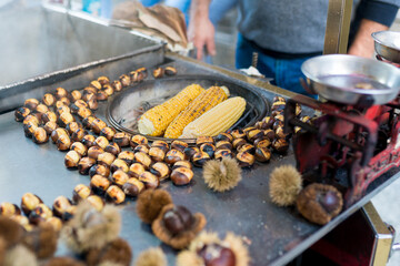 Famous and cheapest  turkish street foods.  Grilled corn and roasted chestnuts in cart in Istanbul....