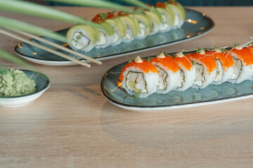 Hot tempura sushi on a gray dish close-up