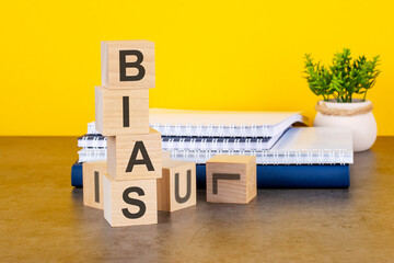 bias word written on wooden cubes with copy space - obrazy, fototapety, plakaty