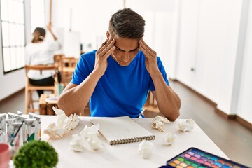 Paint student man stressed painting at art school.