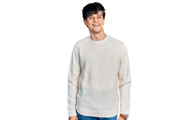 Handsome hipster young man wearing casual winter sweater with a happy and cool smile on face. lucky...