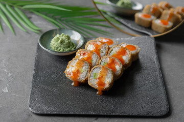 Hot tempura sushi on a gray dish close-up