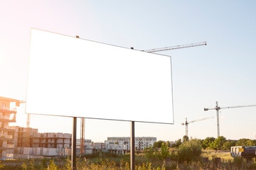 Blank white billboard for advertisement in front of the construction site © diesirae