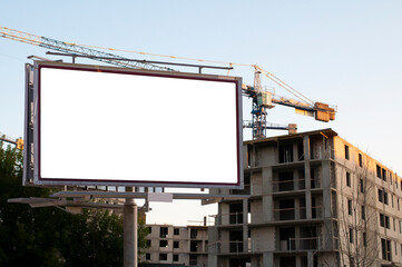 Blank white billboard for advertisement in front of the construction site