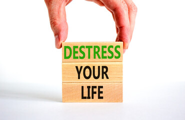 Fototapeta na wymiar Destress your life symbol. Concept words Destress your life on wooden blocks. Doctor hand. Beautiful white table white background. Psychological business and destress your life concept. Copy space.