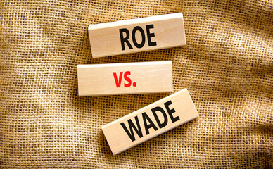 Abortion process Roe versus Wade symbol. Concept words Roe versus Wade on wooden blocks. Beautiful canvas table canvas background. Abortion process Roe versus Wade concept. Copy space.