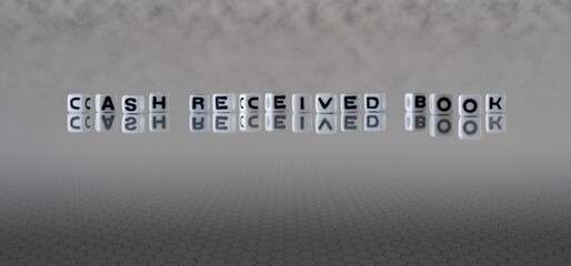 cash received book word or concept represented by black and white letter cubes on a grey horizon background stretching to infinity