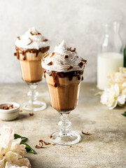 Chocolate milkshake with whipped cream and chocolate decoration