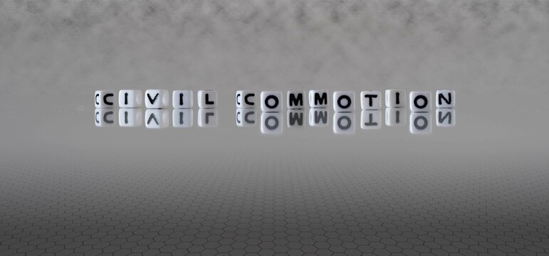 Civil Commotion Word Or Concept Represented By Black And White Letter Cubes On A Grey Horizon Background Stretching To Infinity