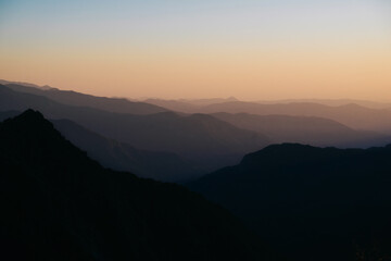 Background of soft shadows of the foggy mountains