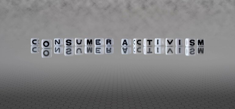 Consumer Activism Word Or Concept Represented By Black And White Letter Cubes On A Grey Horizon Background Stretching To Infinity