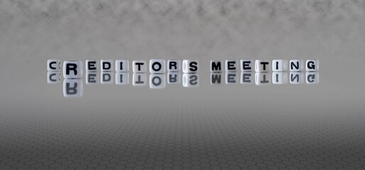 creditors meeting word or concept represented by black and white letter cubes on a grey horizon background stretching to infinity