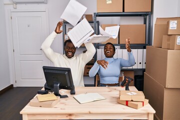 Man and woman ecommerce business workers throwing paperwork at office