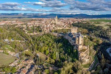 Fototapeta na wymiar View of the Alcazar fortress and St Mary cathedral of segovia, listed world Heritage center by UNESCO Panoramic aerial