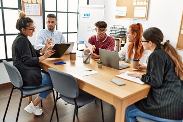 Group of business workers smiling happy working at the office