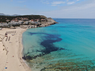 Fototapeta premium Cala Mesquida . Cala Ratjada Beautiful view of the seacoast of Majorca with an amazing turquoise sea, in the middle of the nature. Concept of summer, travel, relax and enjoy