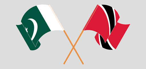 Crossed and waving flags of Pakistan and Trinidad and Tobago